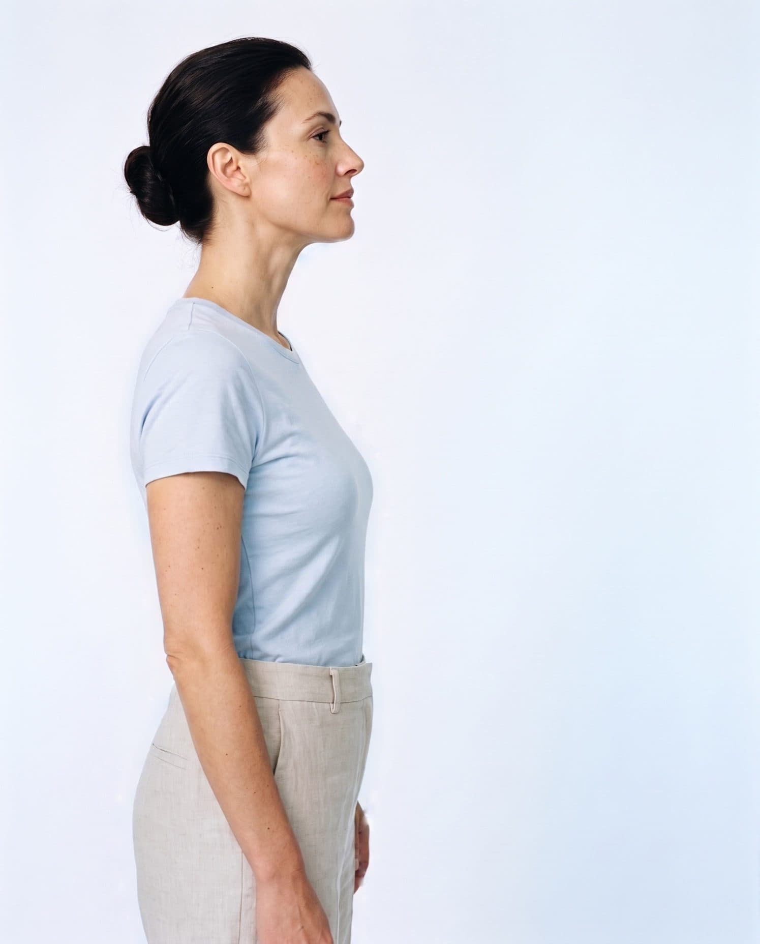 Side profiles of a woman and then a man in pale blue tops, each with a blue outline of the trial-average starting shape drawn around them and closing in